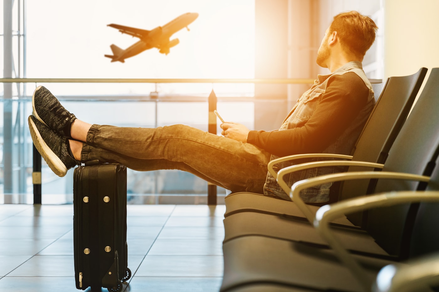 Traveller relaxing at the airport before a flight